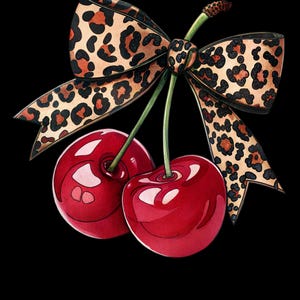 May include: Two red cherries with green stalks and leaves tied together with a brown and black leopard print bow.