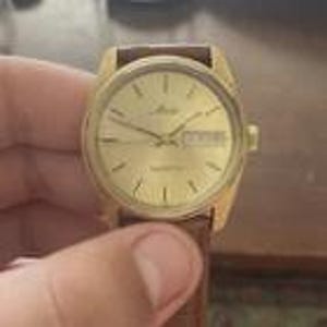 Vintage Men&#39;s Mido Swiss Quartz Watch ESA 9362 Movement Gold Plated Case.  Day Date.  New Leather Strap