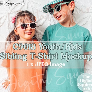 May include: Two children wearing sunglasses and t-shirts. The girl is wearing an orange t-shirt, and the boy is wearing a teal t-shirt. The image includes the text "C9018 Youth/Kids Sibling T-Shirt Mockup" and "1 x JPEG Image."