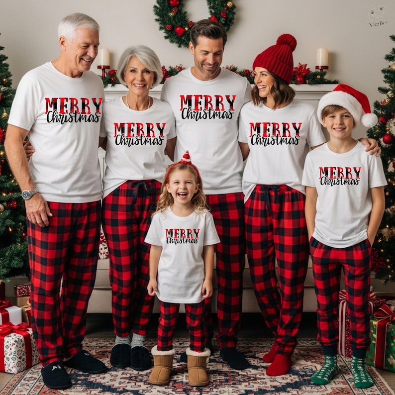 May include: A family of seven wearing matching Christmas pajamas. Each person is wearing a white t-shirt with "MERRY Christmas" in red and black lettering. The pajamas are red and black plaid. A Christmas tree and decorations are in the background.
