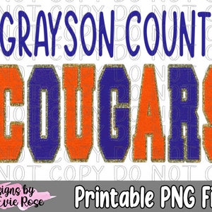Puede incluir: Un diseño de sublimación con el texto "GRAYSON COUNTY COUGARS" en letras azules y naranjas con detalles de purpurina dorada. El diseño está sobre un fondo blanco.