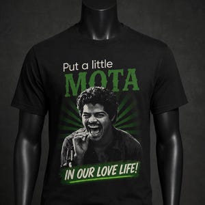 May include: Black t-shirt with the text "Put a little MOTA in our love life!" in green. The shirt features a black and white image of a man laughing. The word "MOTA" is in large, bold letters.