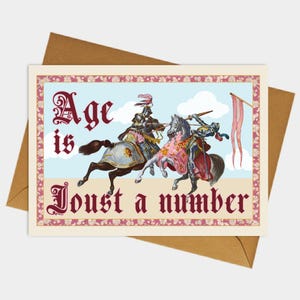 May include: Greeting card featuring a vintage illustration of two knights jousting on horseback. The card has the text "Age is Joust a number" in decorative lettering, set against a sky blue background with clouds.