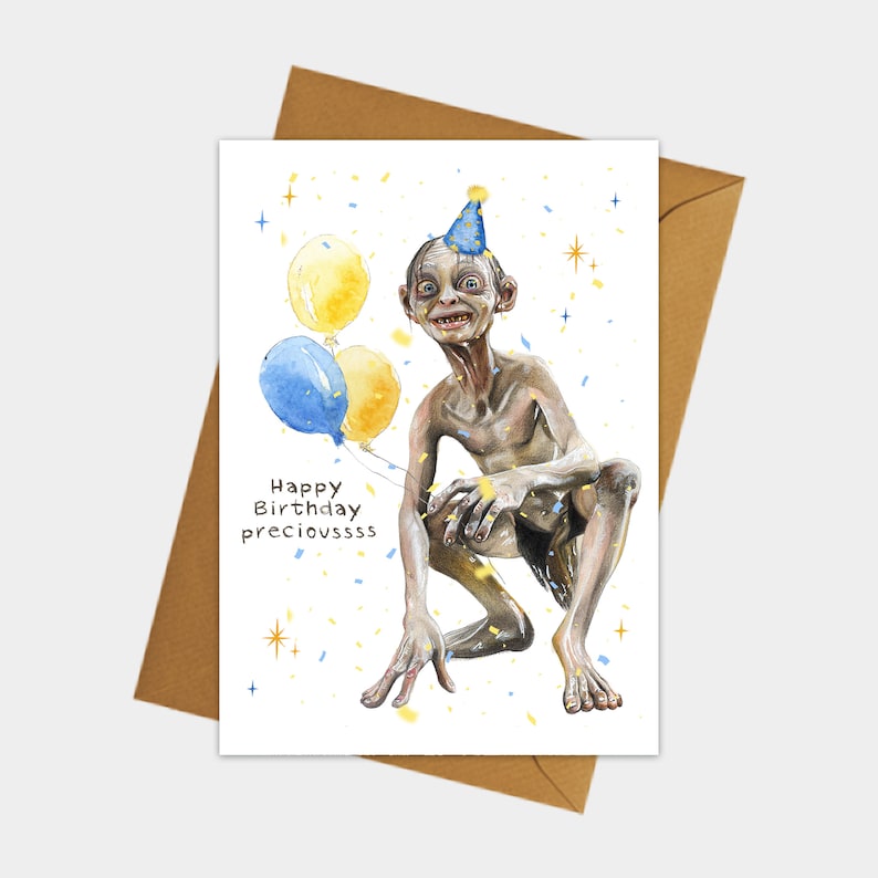 Puede incluir: Una tarjeta de cumplea&ntilde;os con una ilustraci&oacute;n de acuarela de Gollum del Se&ntilde;or de los Anillos con un gorro de fiesta y sosteniendo globos. La tarjeta dice "Happy Birthday precioussss".