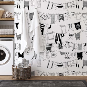 Self adhesive removable black and white Laundry Room Wallpaper with hanging clothes for DIY décor projects.