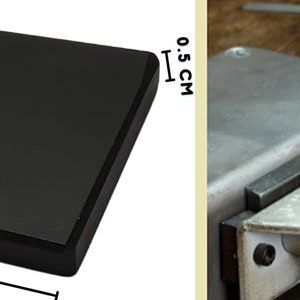 May include: A black rectangular jeweler's bench block, 5.00 cm long, 3.8 cm wide, and 0.5 cm thick. The block is used for jewelry making and repair. A glass bottle and a dropper are also visible.
