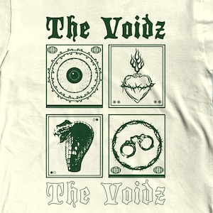 May include: Off-white t-shirt with the text "The Voidz" in green, above four green square graphics. The graphics include an eye, a heart with flames, a snake, and handcuffs. The shirt is a crew neck.