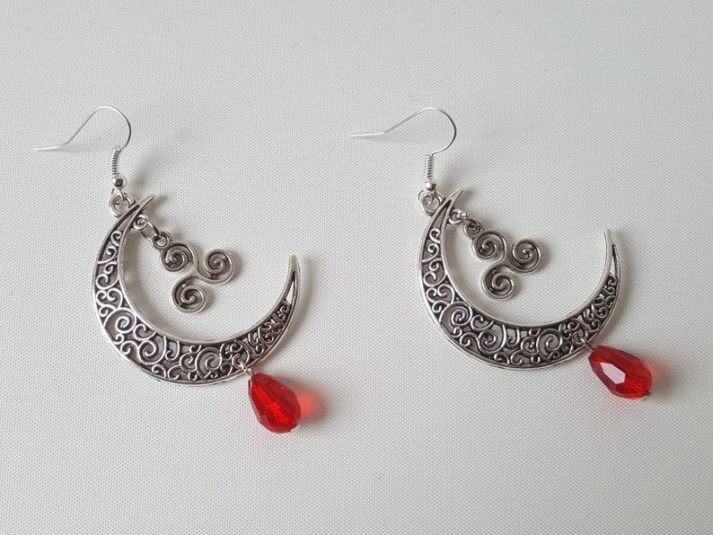 Sickle moon earrings with celtic triskele and faceted glass bead
