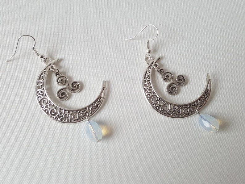 Sickle moon earrings with celtic triskele and faceted glass bead
