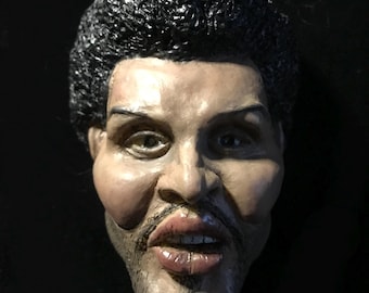 Collectible figure of a famous musician Plastic figurine with magnet. 4.3 /3.5 in.