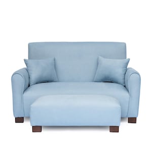 May include: A light blue loveseat with rounded armrests and two matching square throw pillows, accompanied by a rectangular ottoman. The furniture set features a textured fabric upholstery and is supported by four dark brown wooden block feet.