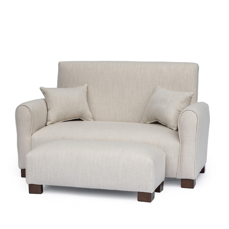 May include: A beige loveseat with a textured fabric finish, featuring rounded armrests, a straight backrest, and two matching square throw pillows. The loveseat is paired with a rectangular ottoman, both supported by dark brown wooden block feet.