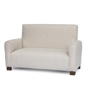 May include: A two-seater sofa upholstered in a light beige, textured fabric. The piece features a straight backrest, rounded armrests, and a single continuous seat cushion. It is supported by four short, dark brown wooden block feet.