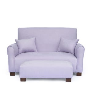 May include: A light purple loveseat with two matching square throw pillows and a rectangular ottoman. The furniture features rounded armrests and dark brown block feet, all upholstered in a solid, light purple fabric with a subtle texture.