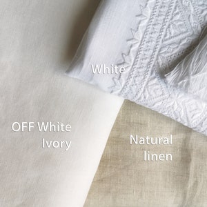 May include: Three fabric swatches in different shades of white and natural linen. The swatches are labeled "White", "Off White Ivory", and "Natural Linen".