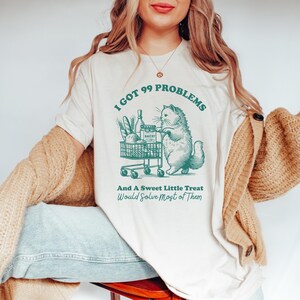猫のグラフィックTシャツ、ぽっちゃり猫の食料品カートTシャツ、面白い猫好きへのギフト、かわいい動物シャツ、ぽっちゃり猫のアパレル、トレンディな猫シャツ