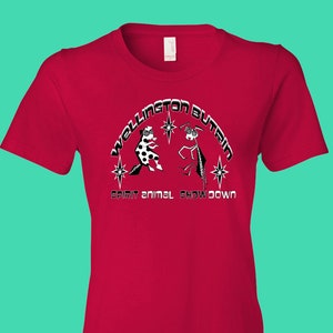 May include: Red women's t-shirt with a black and white graphic of two animals facing each other. The text "Wellington Butrim" and "Spirit Animal Showdown" is printed on the shirt.
