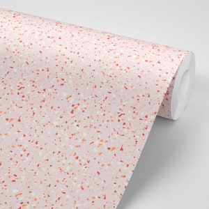 Puede incluir: Papel tapiz de terrazo rosa con fondo blanco y motas rojas, naranjas y blancas.