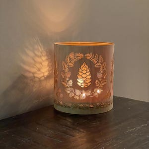 A Christmas candle holder. Wood and Glass lantern with a pinecone design. The perfect gift for candle lovers.Large size - Maple or Oak