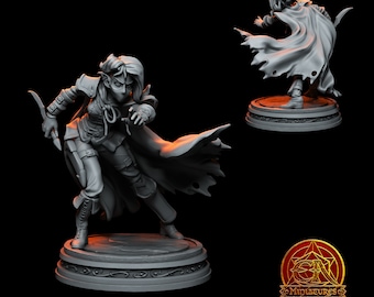 May include: A grey painted miniature figurine of an elf warrior with a cloak and a dagger. The elf is wearing a mask and has a determined expression. The miniature is posed in a dynamic action pose.