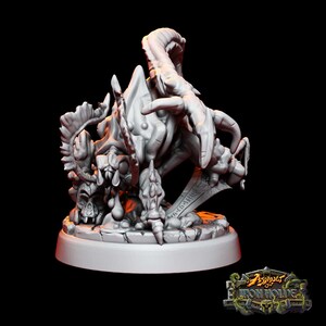 May include: A grey, detailed, 3D printed miniature of a monstrous creature with a long, curved tail and a skull at its base. The creature is standing on a circular base with a cracked surface. The miniature is part of the "Assault on Iron Hold" game.