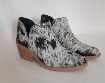 black and white cowhide boots