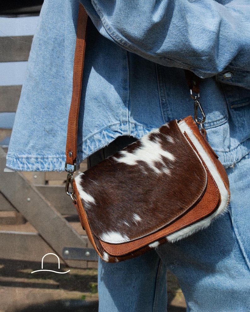 Give the gift of timeless style this Christmas. This cowhide crossbody bag, handcrafted in Argentina, is a unique and thoughtful present for someone special.