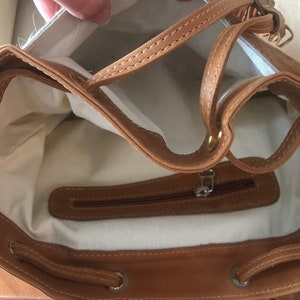 Outter pocket under the lid
