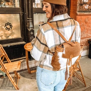 Cowhide backpack. Hair on leather backpack bag with tassels. Genuine cowhide bag for women. Boho western backpack purse.