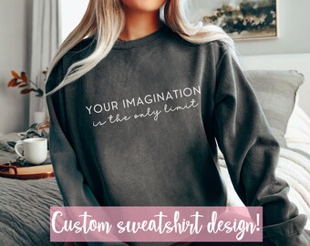 Pode incluir: Uma camisa de moletom cinza escuro com o texto "Your imagination is the only limit" em letras brancas. A camisa de moletom é um design personalizado.