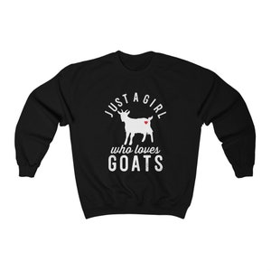 May include: Black sweatshirt with a white graphic of a goat and the text "Just a girl who loves goats".