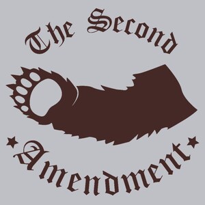 May include: A brown bear paw print with claws, with the text "The Second Amendment" in a stylized font around the paw print.