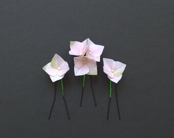 Conjunto de flores para el cabello de hortensias blancas para boda.