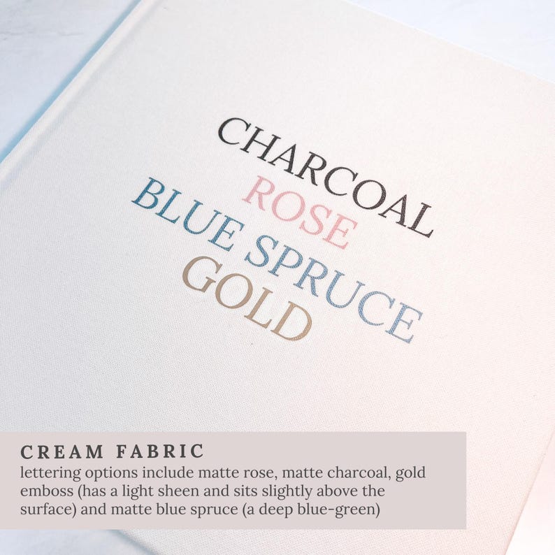 May include: Cream fabric with the words CHARCOAL, ROSE, BLUE SPRUCE, and GOLD printed on it. The text is in various colors, including black, pink, blue, and gold. The bottom of the image has the text CREAM FABRIC.