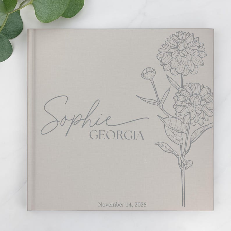 May include: A light grey book cover featuring the name "Sophie" and the word "Georgia" in script. A floral illustration is on the right. The date "November 14, 2025" is printed at the bottom of the cover.