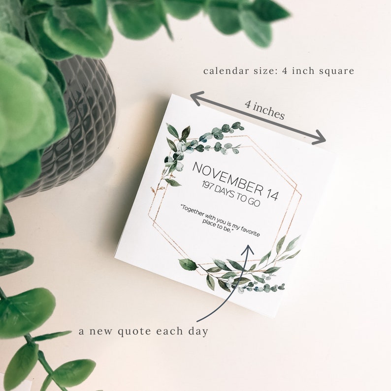 K&ouml;nnte beinhalten: Ein quadratischer Kalender mit einer Gr&ouml;&szlig;e von 10 cm mit einem floralen Design und dem Text "NOVEMBER 14, 197 DAYS TO GO" sowie einem Zitat: "Together with you is my favorite place to be."