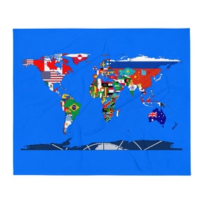 May include: A blue blanket featuring a world map design with country flags. The map is centered and shows continents and countries in vibrant colors. The blanket is a solid blue color.