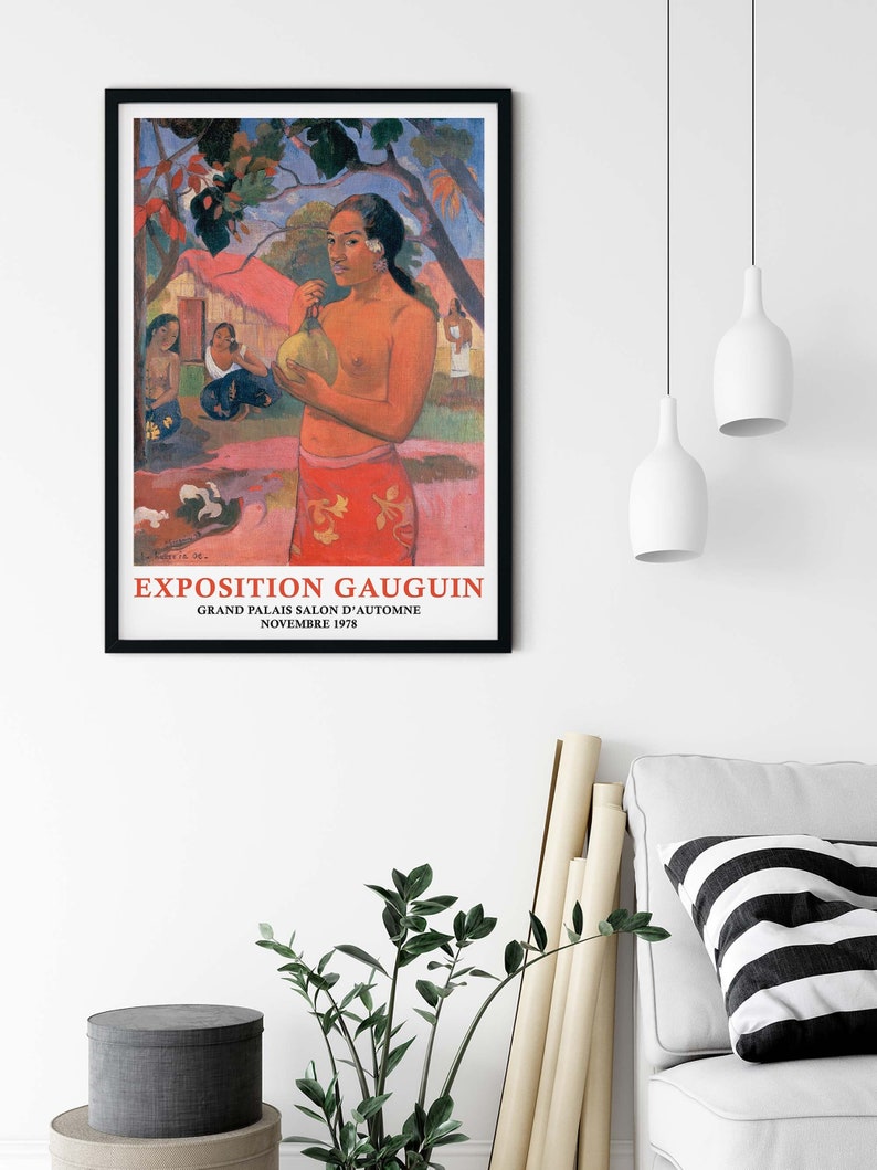 May include: A vintage poster advertising an exhibition of artwork by Paul Gauguin. The poster features a painting of a Tahitian woman holding a fruit. The text on the poster reads "Exposition Gauguin, Grand Palais Salon d'Automne, Novembre 1978."