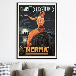 May include: Vintage poster advertising "Nerma" Egyptian cigarettes. A woman in a flowing orange dress and headdress stands on a rock formation, holding a cigarette. The poster has a dark blue background with a moon and stars.