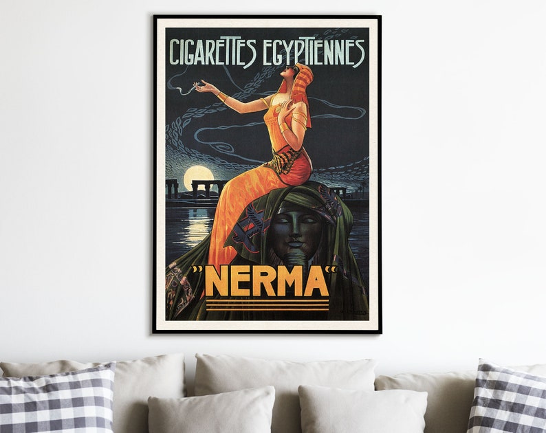 May include: Vintage poster advertising "Nerma" Egyptian cigarettes. A woman in a flowing orange dress and headdress stands on a rock formation, holding a cigarette. The poster has a dark blue background with a moon and stars.
