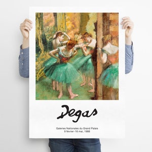 May include: A painting by Edgar Degas depicting a group of dancers in green tutus. The dancers are in a studio setting, with a wooden barre in the background. The painting is titled "Degas" and includes the text "Galeries Nationales du Grand Palais 9 fevrier - 16 mai, 1988."