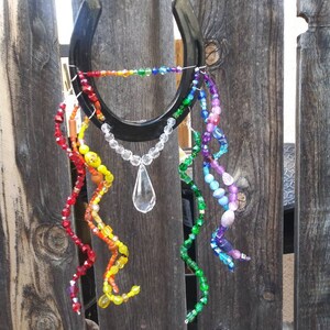 Rainbow adorned/decorated horseshoe