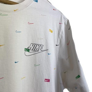 white rainbow nike shirt