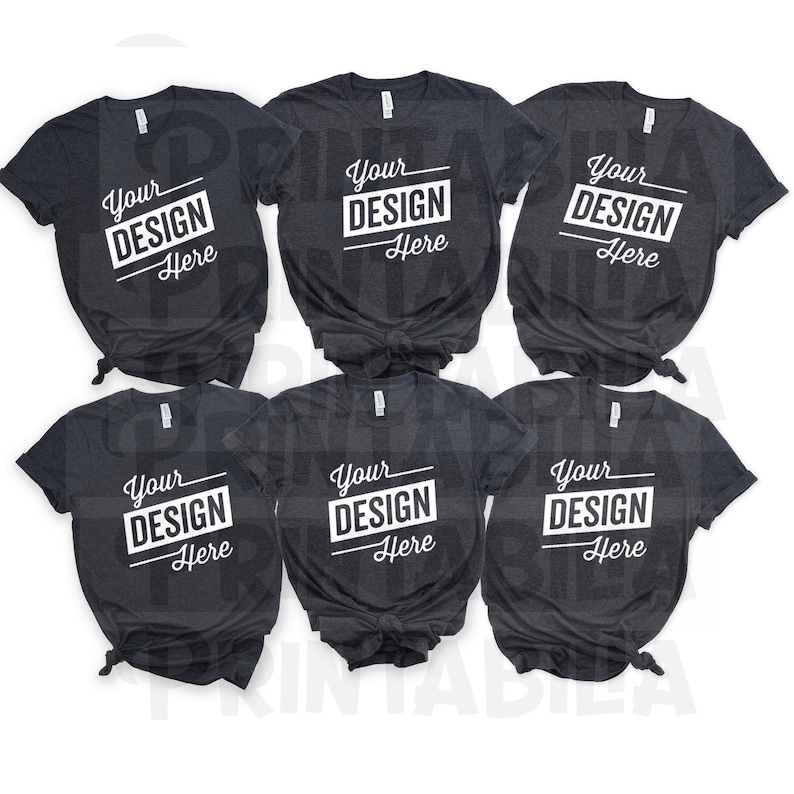 Puede incluir: Seis camisetas de color gris oscuro jaspeado con un dise&ntilde;o blanco que dice "Your Design Here" en cada camiseta.