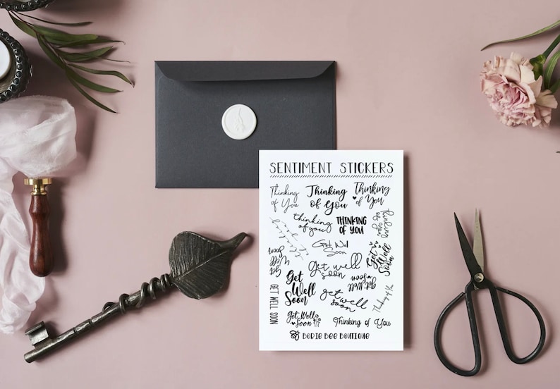 Puede incluir: Una hoja de papel blanco con texto negro que dice "Sentiment Stickers" y presenta una variedad de pegatinas con frases como "Thinking of You" y "Get Well Soon".