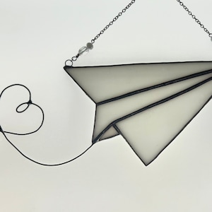 Paper plane with heart trail