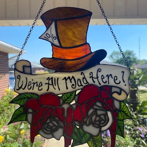 We’re all mad here! Painting the roses red.