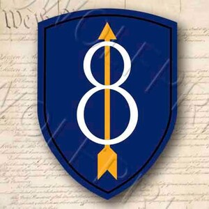 May include: A blue shield with a white number eight and a yellow arrow pointing upwards. The shield is a military unit patch.