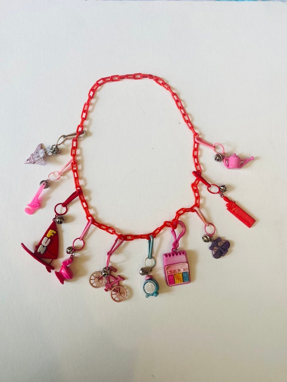 1980s vintage plastic bell charm necklace with ten