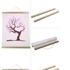 May include: Two sets of poster hangers with a wooden frame and a white canvas featuring a pink cherry blossom tree design. Each set includes a hanging rod and a rolling tube for storage.